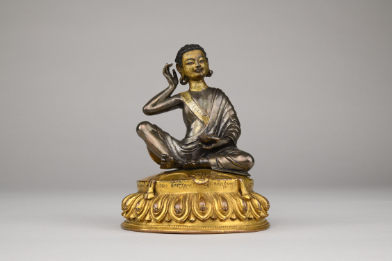 Figure of Milarepa
Central Tibet
15th–18th century
Parcel gilt silver with gilt bronze base
H. 13 cm
Nyingjei Lam Collection